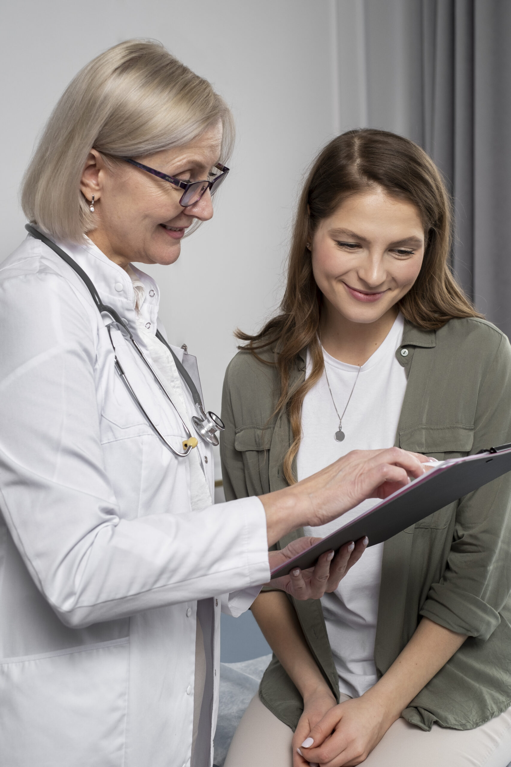 smiley-doctor-patient-chatting-medium-shot